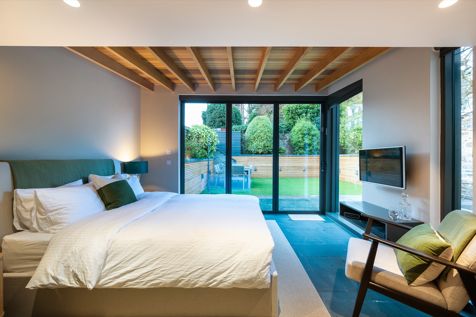 Wide bedroom with full garden view