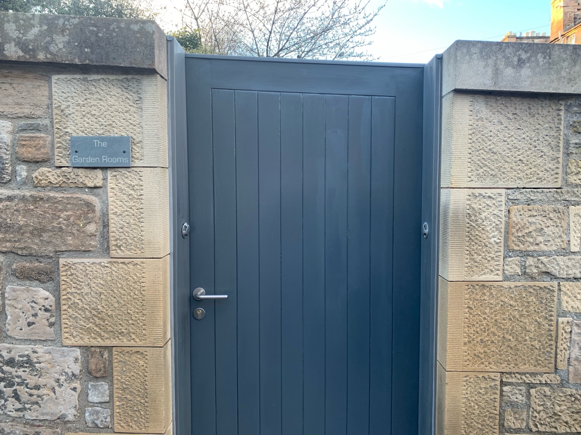 Private entrance gate with Garden Rooms sign