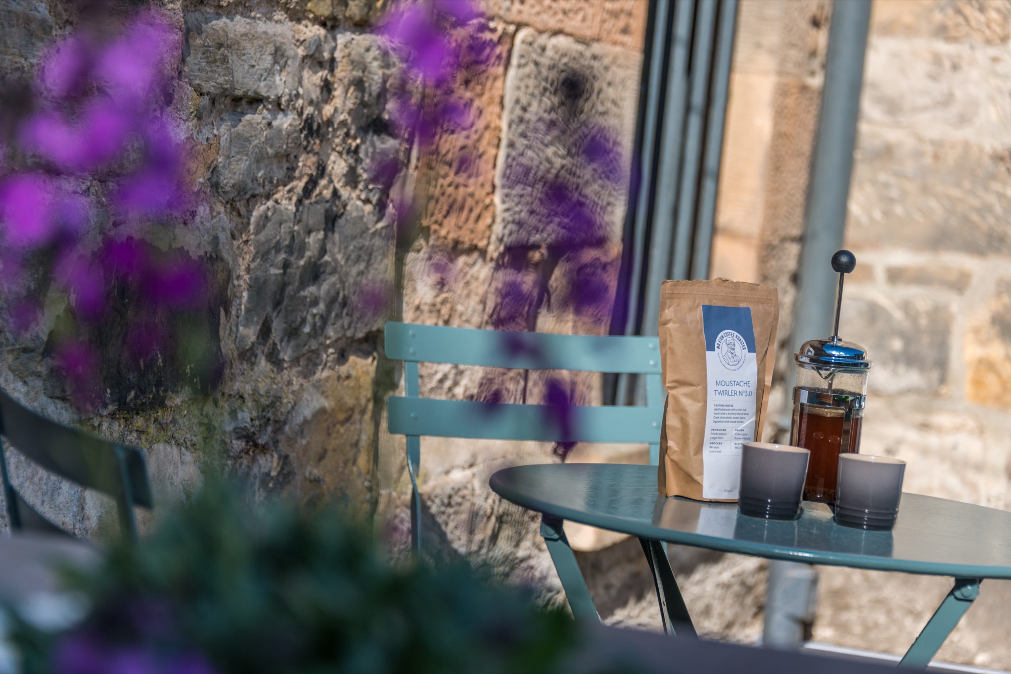 Garden bistro with coffee and flowers