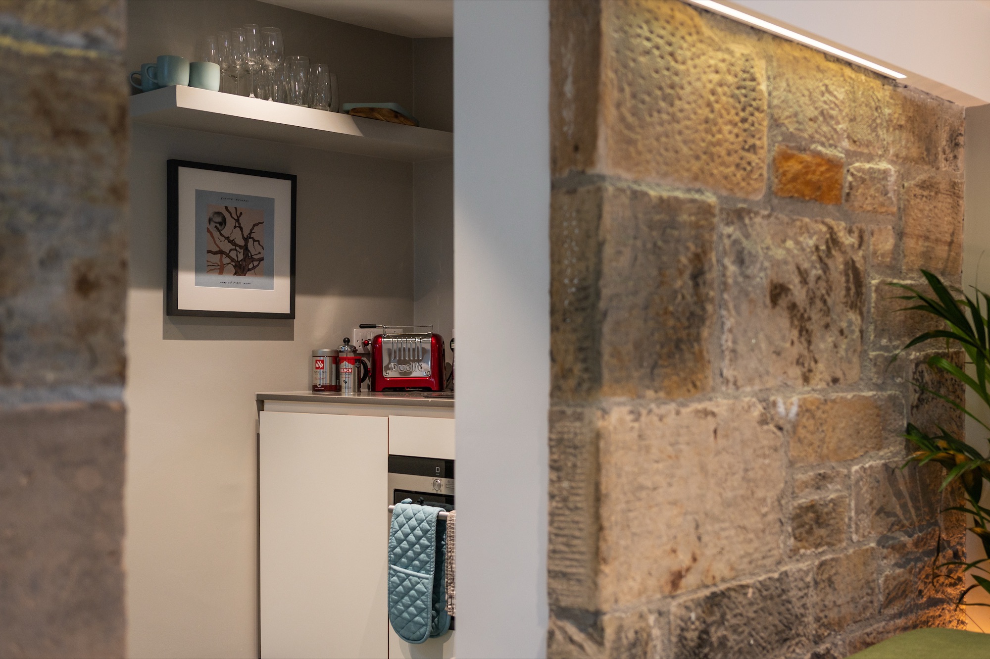 Nespresso coffee station against stone wall