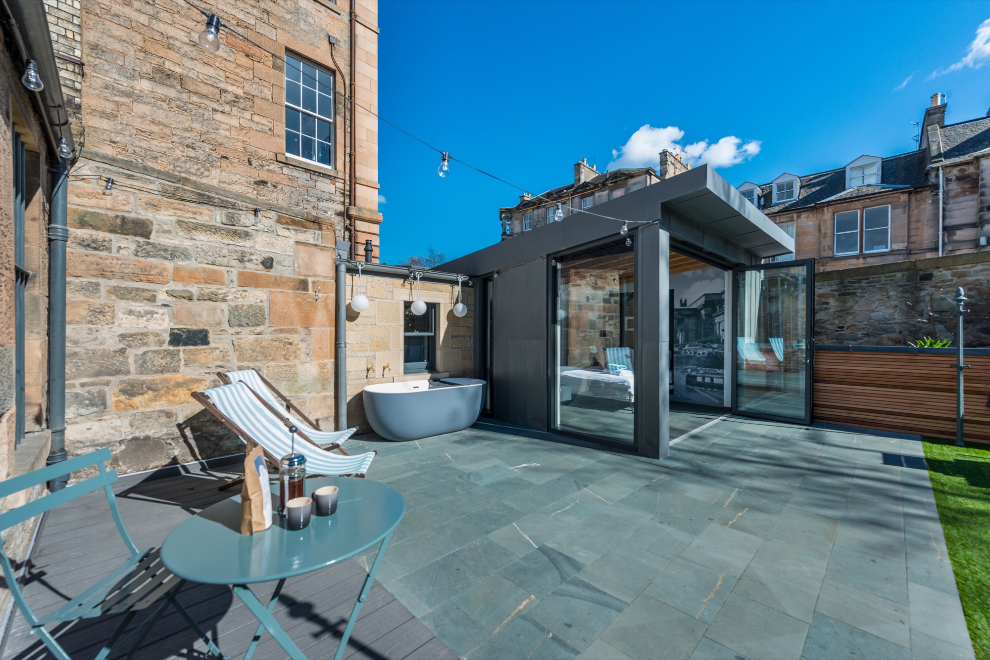 Outdoor bath with champagne on a sunny day